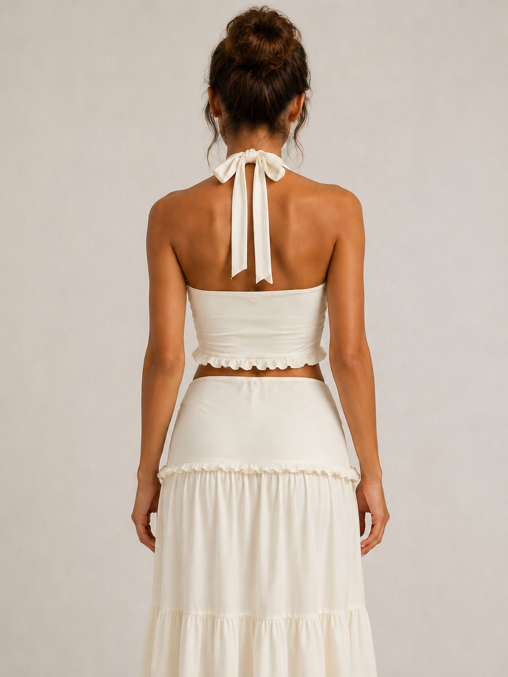 Elévaison Elara ivory twisted halter crop top and tiered maxi skirt set