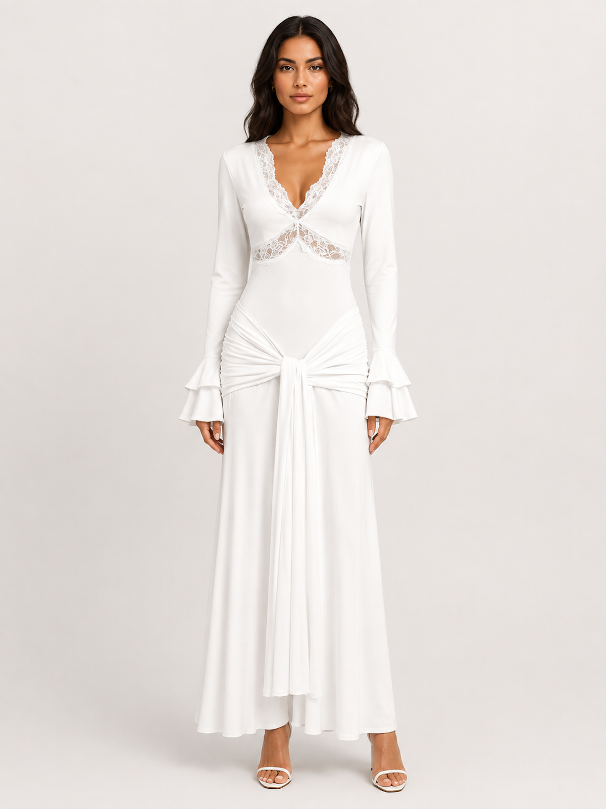 A woman wearing the Elévaison Odette white lace-trim cutout long-sleeve maxi dress, viewed from the front, against a light gray studio background.
