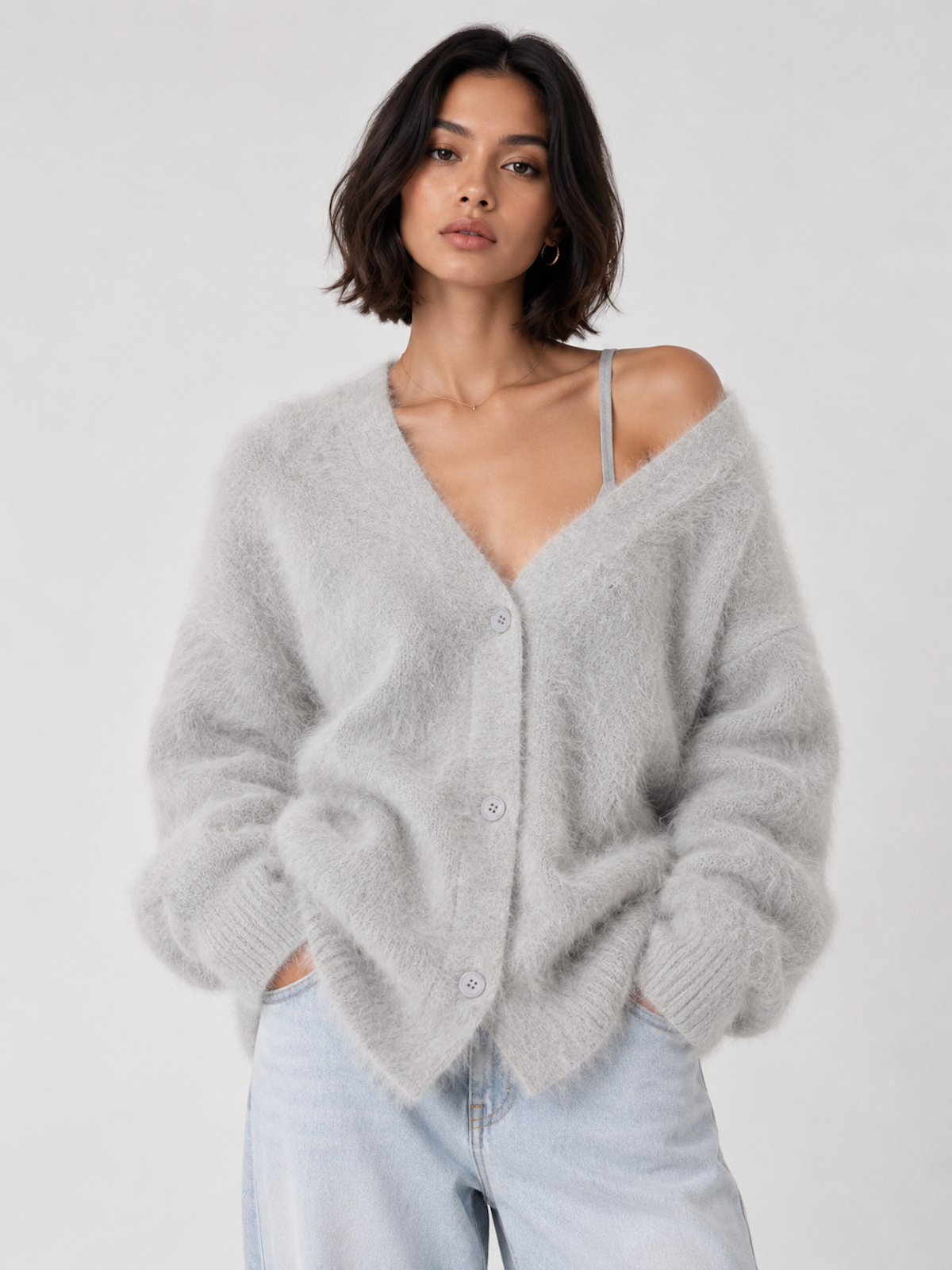 Front view of the light gray Elévaison Alina Cardigan with a V-neck, button front and ribbed hem against a light gray seamless backdrop.