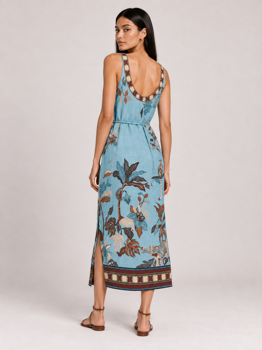 Back view of the Botanical Lagoon Elévaison Daria Dress, showing its sleeveless silhouette and botanical print in studio.
