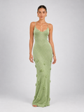 Model wearing the Light Green Elévaison Sabella Dress with a body-hugging maxi silhouette and floral appliqués in studio.
