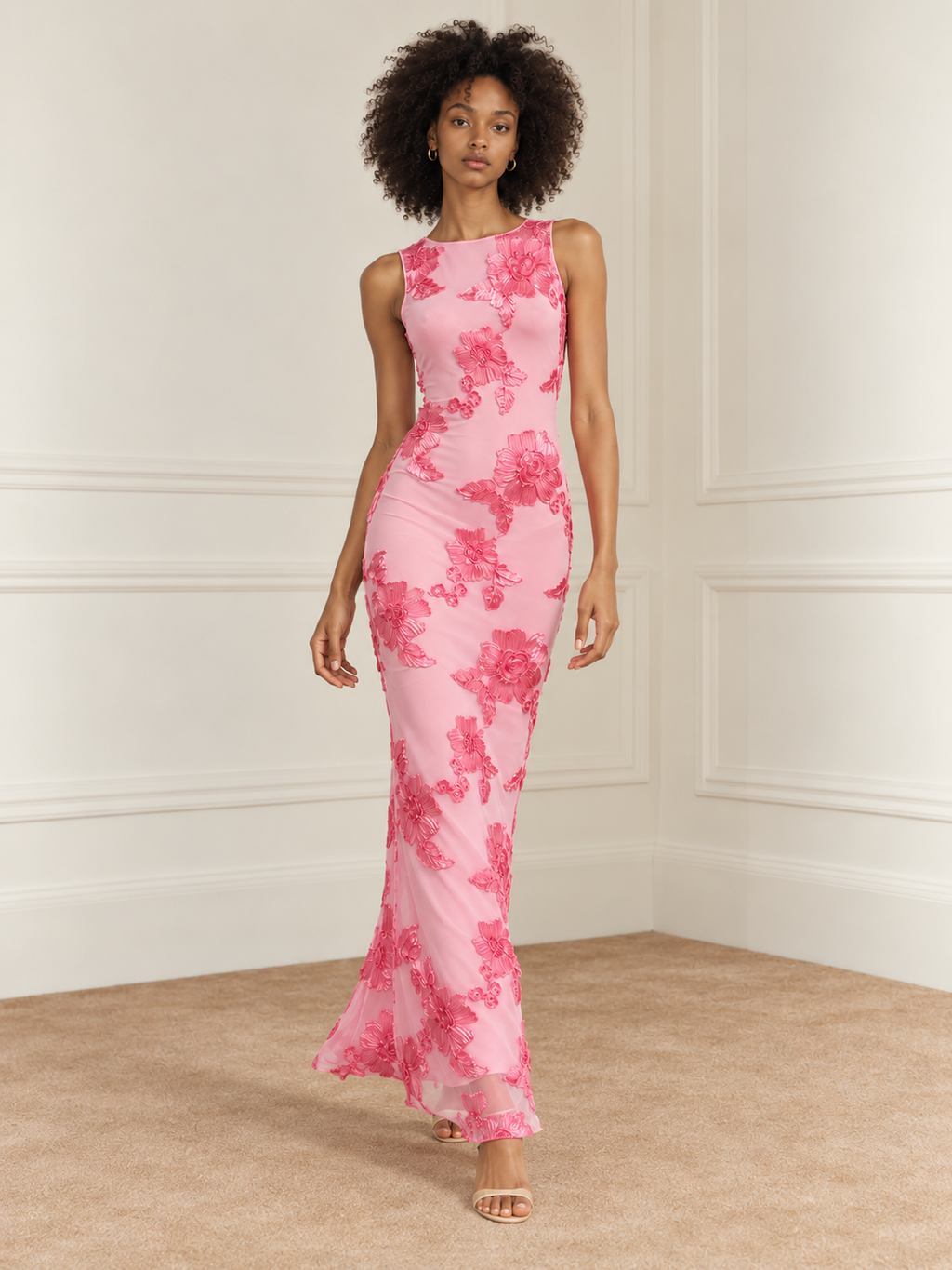 Elévaison Grace Dress in pink, full-length front view showing a sleeveless fitted silhouette and dimensional floral embroidery against a warm cream paneled studio background.