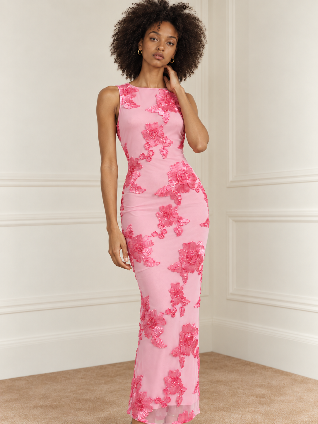 Elévaison Grace Dress in pink, close-up front view showing a sleeveless high neckline and dimensional floral embroidery against a warm cream paneled studio background.