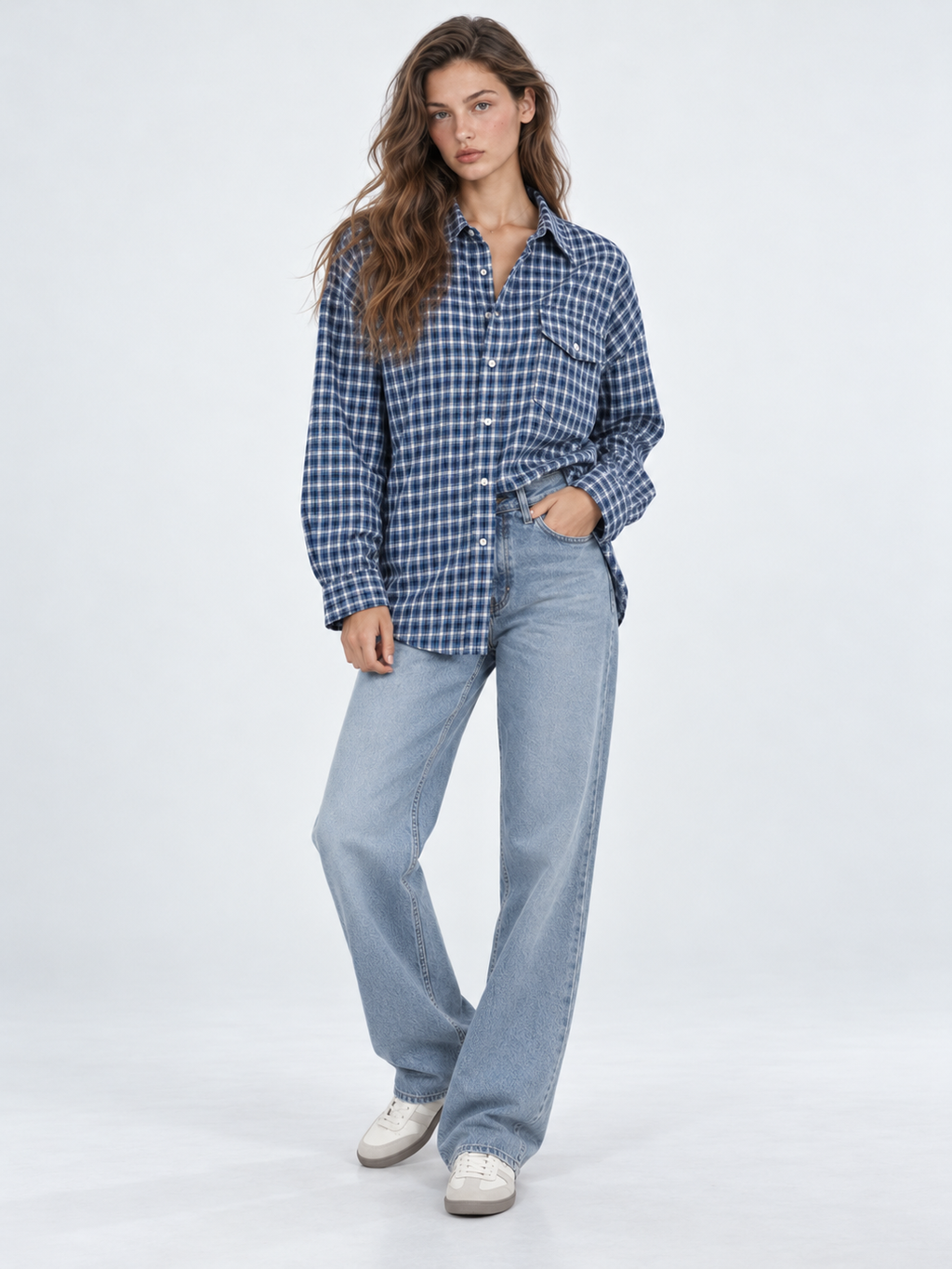 A model pairs the Elévaison Audrey Cotton Shirt in Twilight Check with light blue jeans against a light gray studio backdrop.